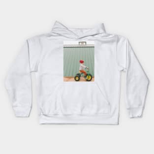 a child on a bicycle Kids Hoodie